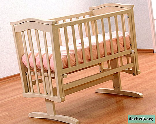 Como escolher uma cama de bebê de madeira maciça, opções possíveis