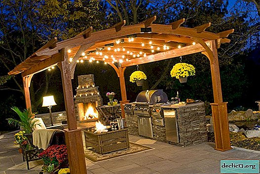 Gazebo with barbecue. Small architecture for a comfortable outdoor recreation